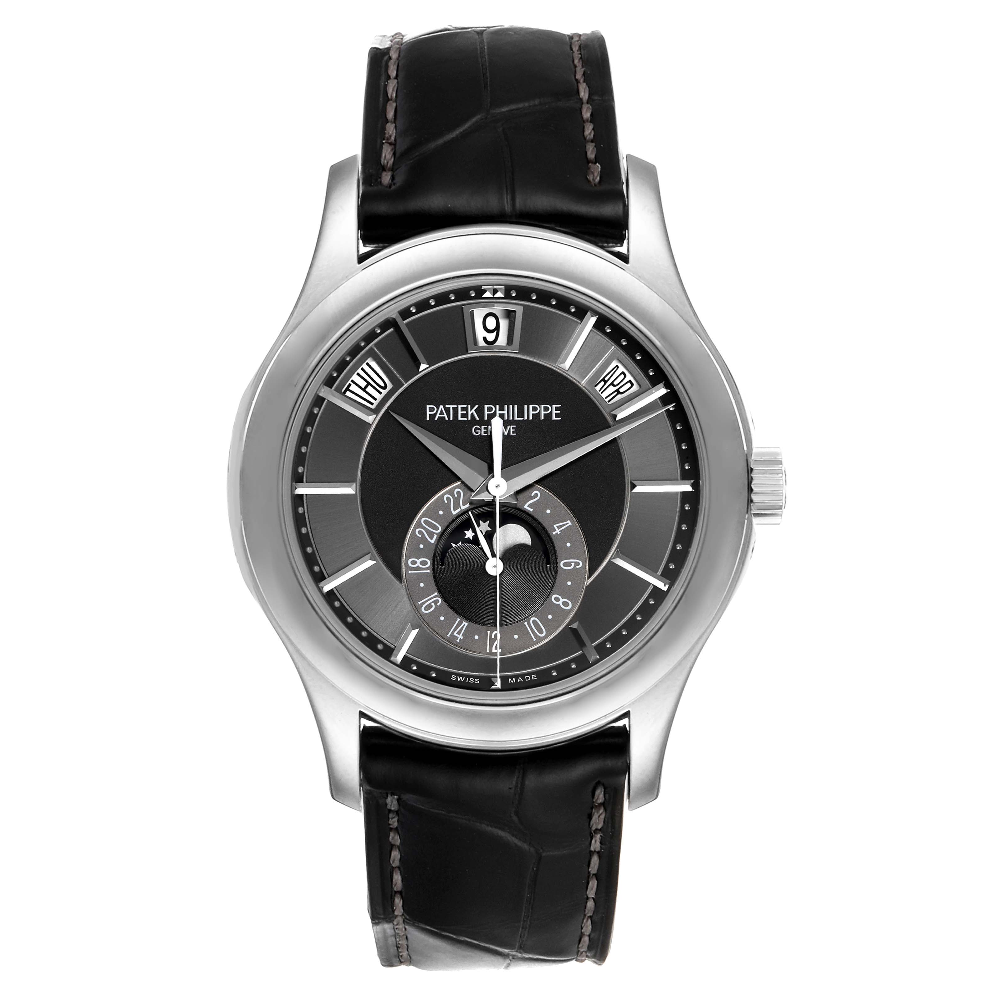The Patek Philippe Complications 5205G - 010 Men's White Gold Grey Dial 5205G - 010 Men's White Gold Grey Dial model watch is shown from a front angle, displaying its dial, case, hands, and strap.