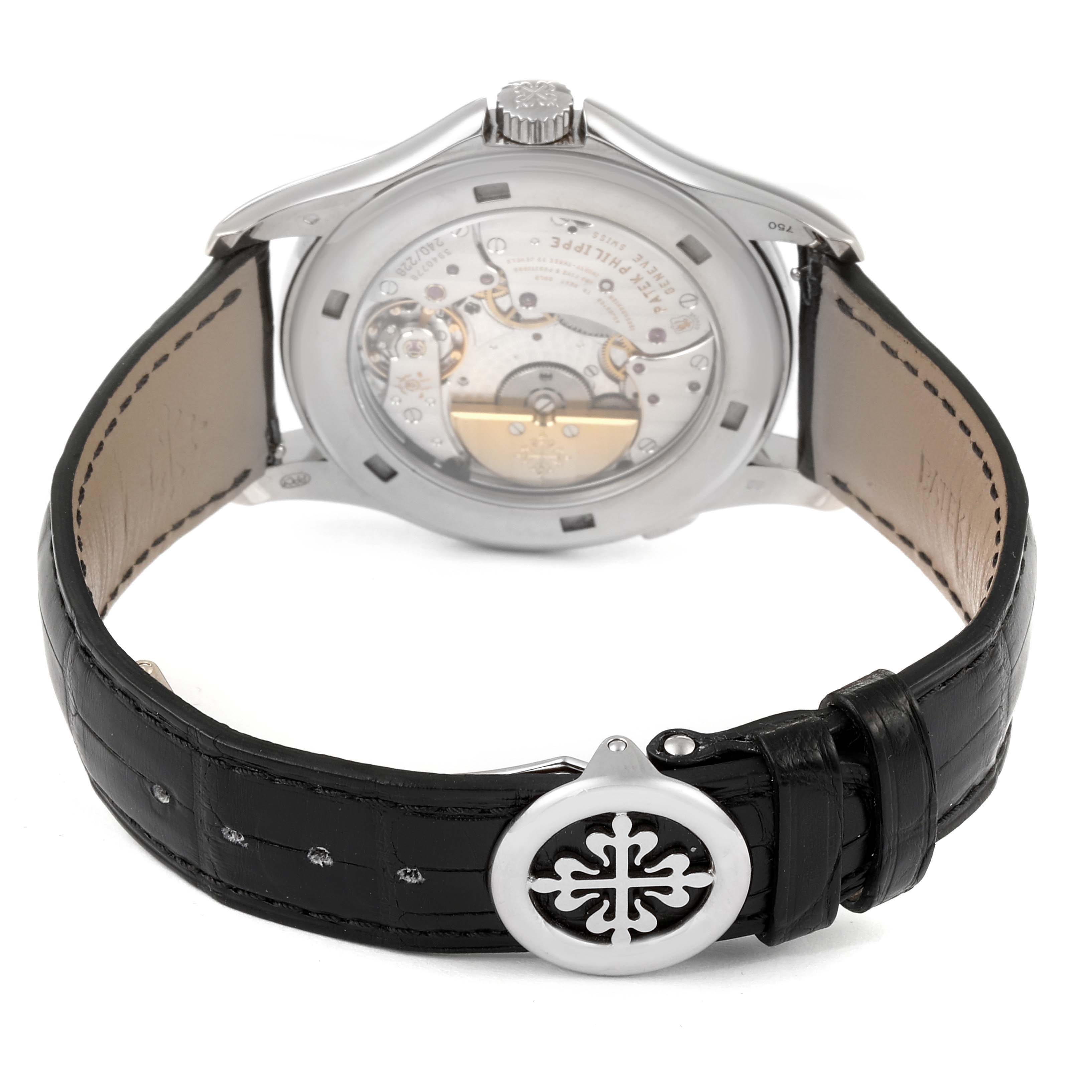 The image shows the back view of the Patek Philippe Complications 5130G-019 Men's White Gold Silver Dial 5130G-019 Men's White Gold Silver Dial watch, highlighting its movement and black leather strap with a clasp.