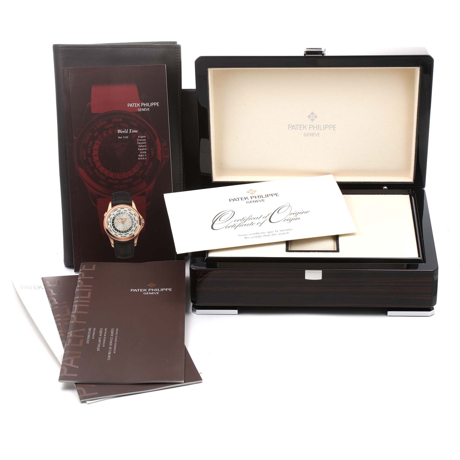 The image shows the packaging, certificate, and manuals for the Patek Philippe Complications 5130G-019 Men's White Gold Silver Dial 5130G-019 Men's White Gold Silver Dial model watch.