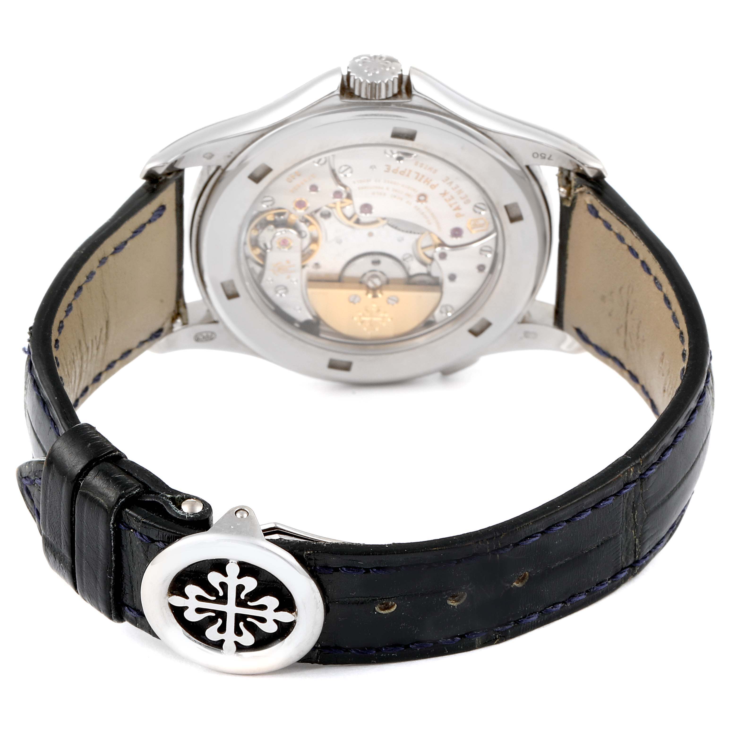 The image shows the back view of a Patek Philippe Complications 5130G-019 Men's White Gold Silver Dial 5130G-019 Men's White Gold Silver Dial watch, highlighting its movement and leather strap.