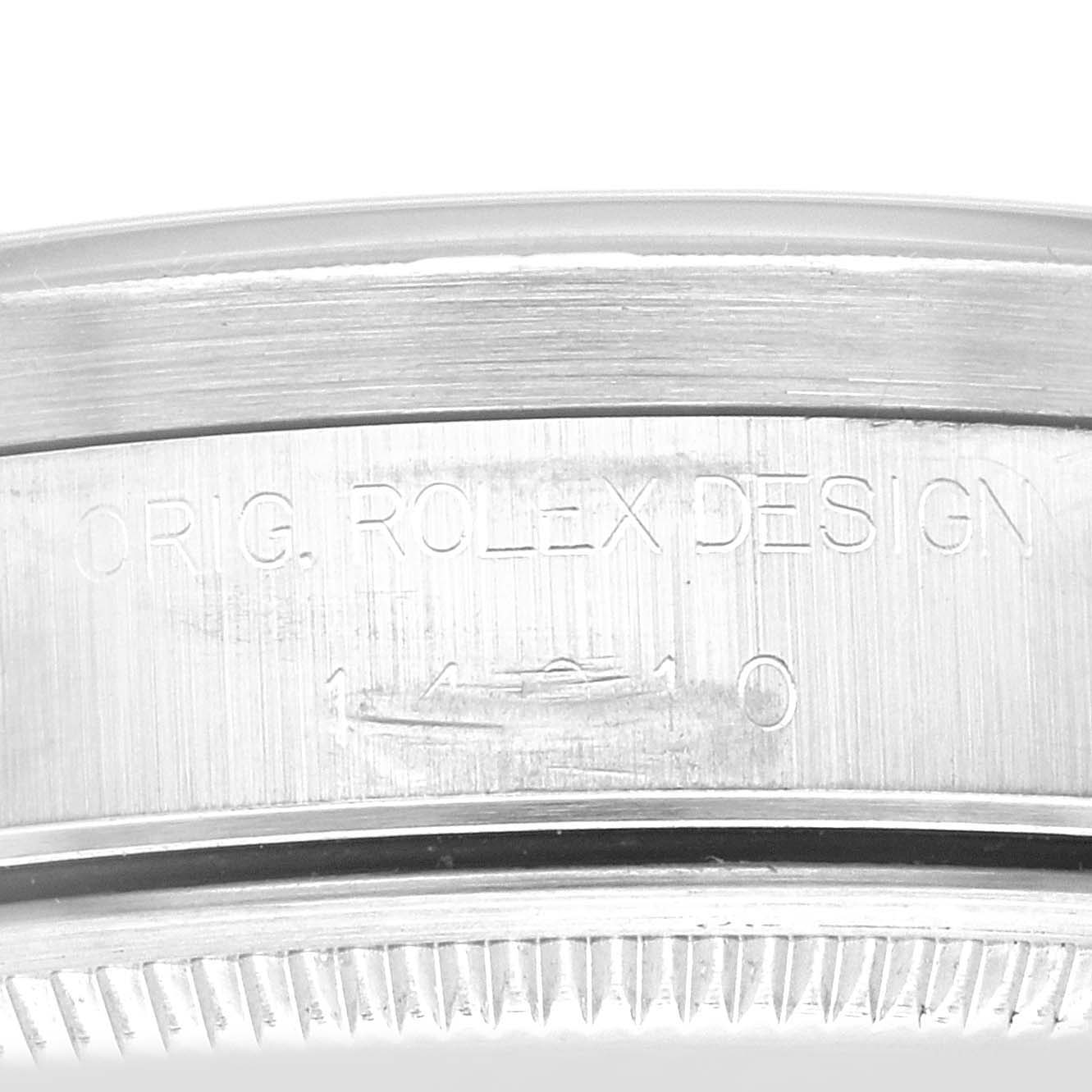 This image shows a close-up of the bezel and case side engraving on a Rolex Air-King 14010 Men's Stainless Steel Blue Dial 14010 Men's Stainless Steel Blue Dial watch.