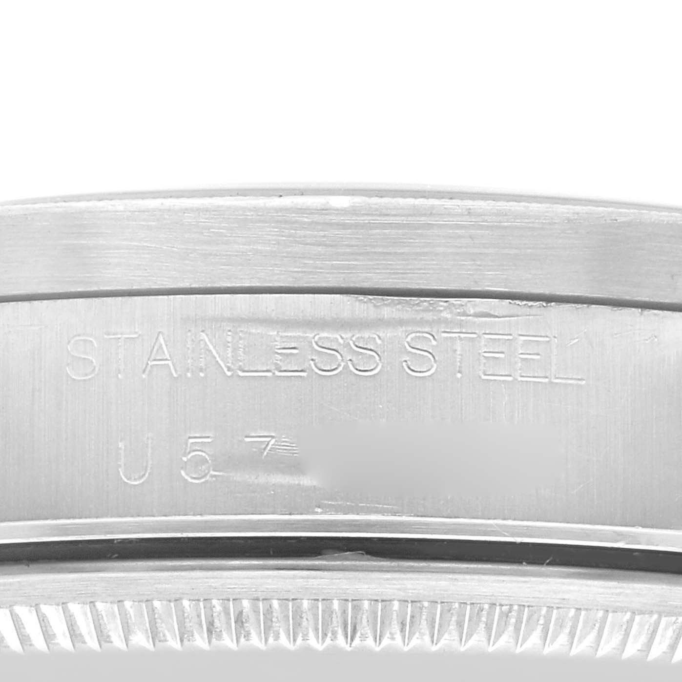 This image shows a close-up of the side of a Rolex Air-King 14010 Men's Stainless Steel Blue Dial 14010 Men's Stainless Steel Blue Dial watch, including the "STAINLESS STEEL" engraving.