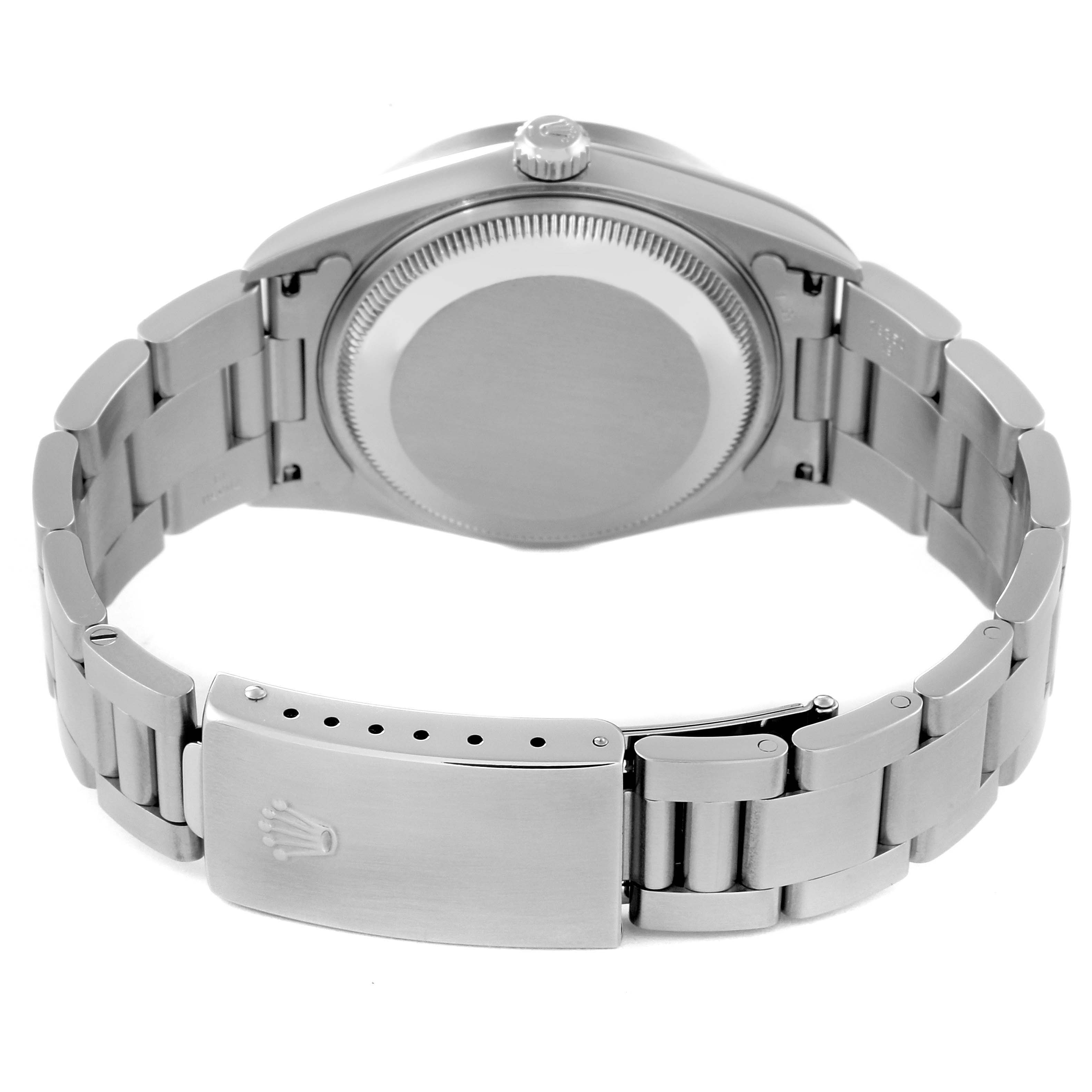 The image shows the back view of a Rolex Date 15210 Men's Stainless Steel Blue Dial 15210 Men's Stainless Steel Blue Dial watch, highlighting its stainless steel case back and bracelet with the clasp open.