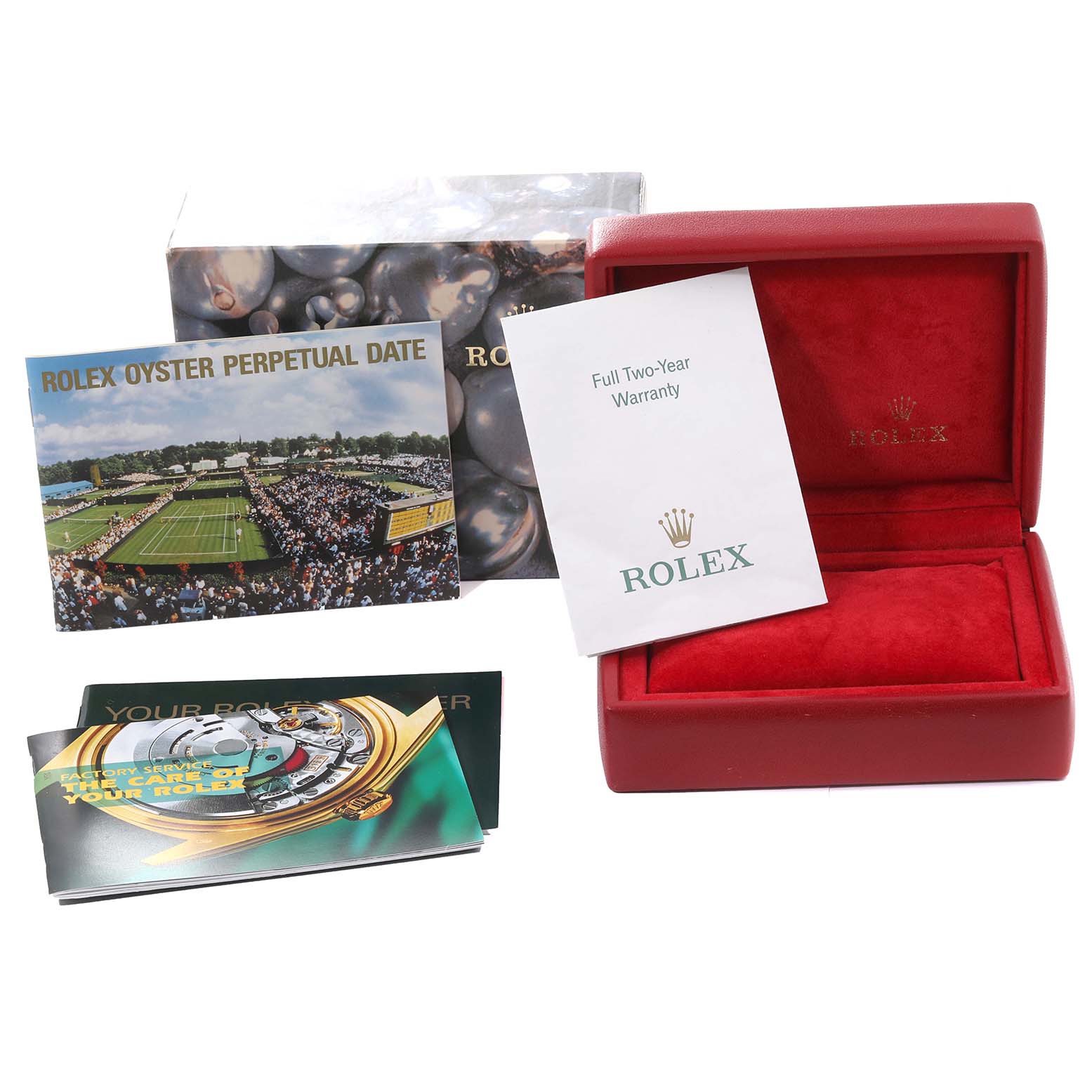 The image shows a Rolex Date 79240 Women
s Stainless Steel Silver Dial 79240 Women
s Stainless Steel Silver Dial model box, warranty card, and manuals, including the "Rolex Oyster Perpetual Date" booklet, all from an elevated angle.