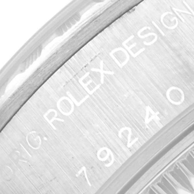 The image shows a close-up of the model number and "Rolex Design" engraving on the side of a Rolex Date 79240 Women
s Stainless Steel Silver Dial 79240 Women
s Stainless Steel Silver Dial watch.