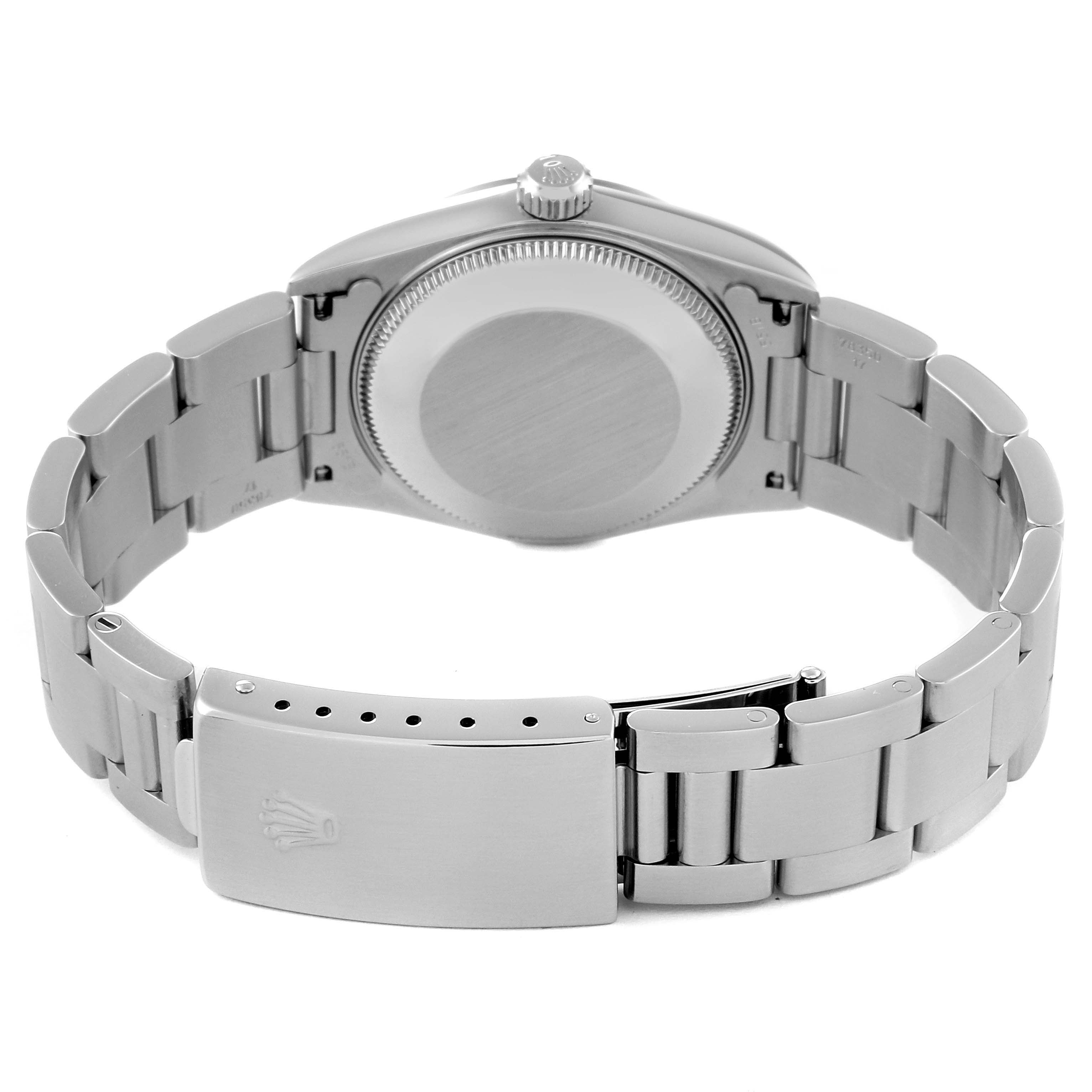 This image shows the back view of a Mid-Size Rolex watch, highlighting the case back and bracelet with clasp.