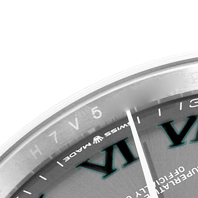 This image shows a close-up of the top right portion of the dial and bezel of a Rolex Datejust 126231 Men's Steel and Gold (two tone) Grey Dial 126231 Men's Steel and Gold (two tone) Grey Dial watch.