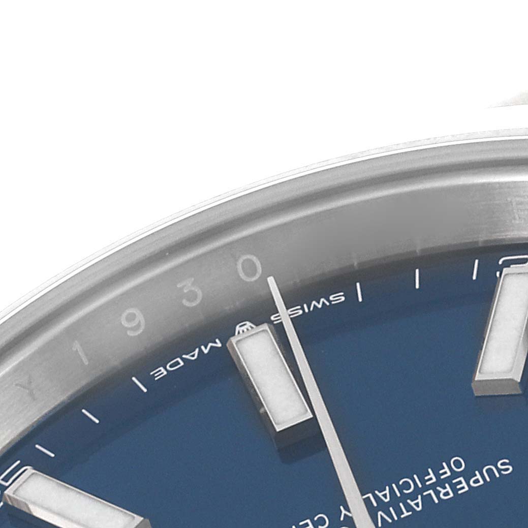 The image shows a close-up of the dial and markers of the Rolex Datejust 41 126300 Men's Stainless Steel Blue Dial 126300 Men's Stainless Steel Blue Dial, highlighting the blue face and part of the bezel.