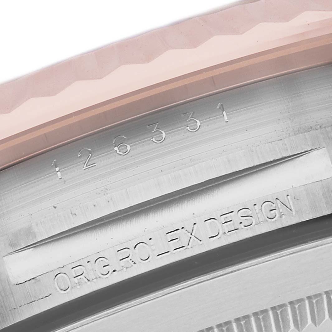 This image shows a close-up of the case side of the Rolex Datejust 41 126331 Men's Steel and Gold (two tone) Brown Dial 126331 Men's Steel and Gold (two tone) Brown Dial, displaying the engraved model number and "ORIG.ROLEX DESIGN" text.