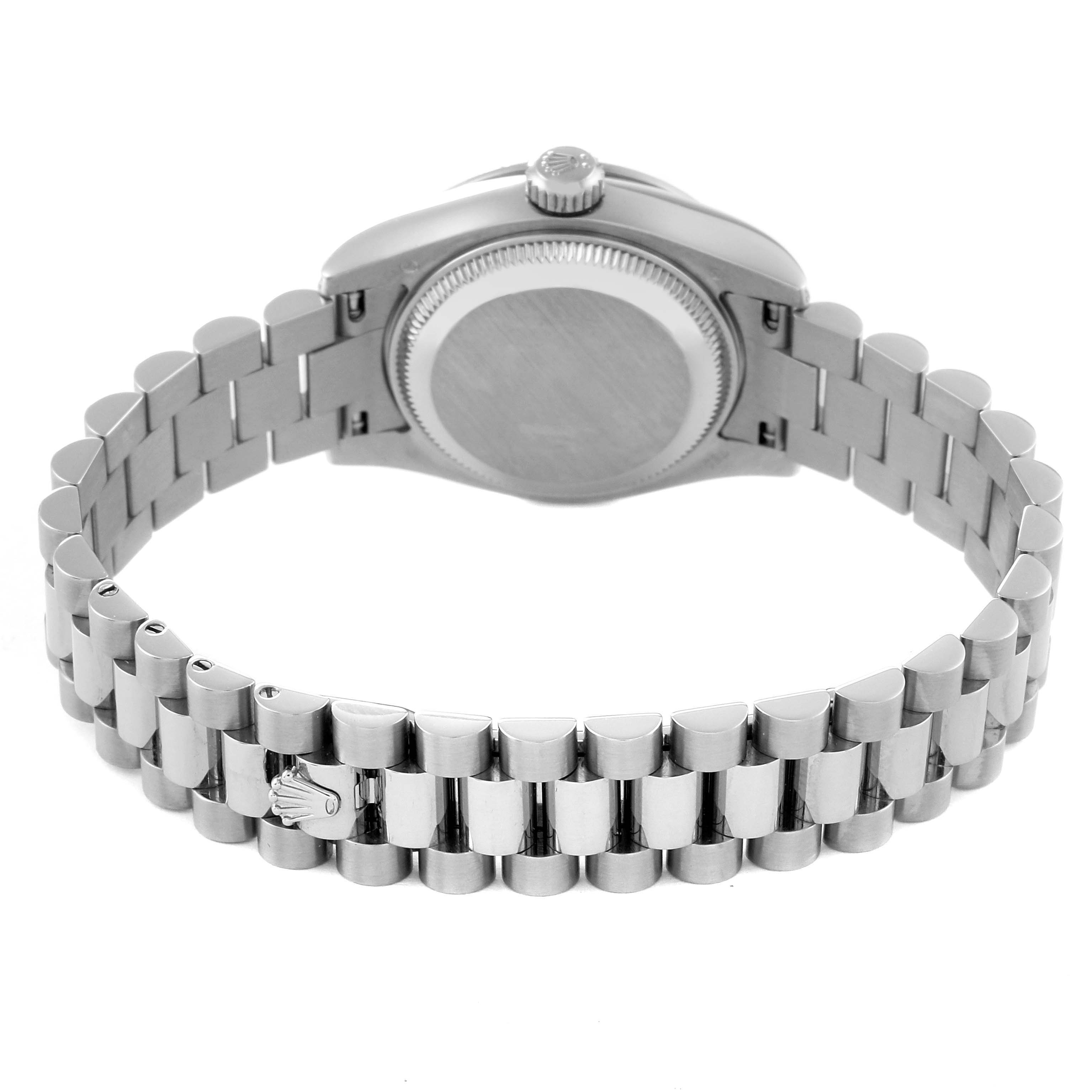 This image shows the Rolex President 179159 Women's White Gold Mother of Pearl Dial 179159 Women's White Gold Mother of Pearl Dial model watch's back case and its stainless steel bracelet.