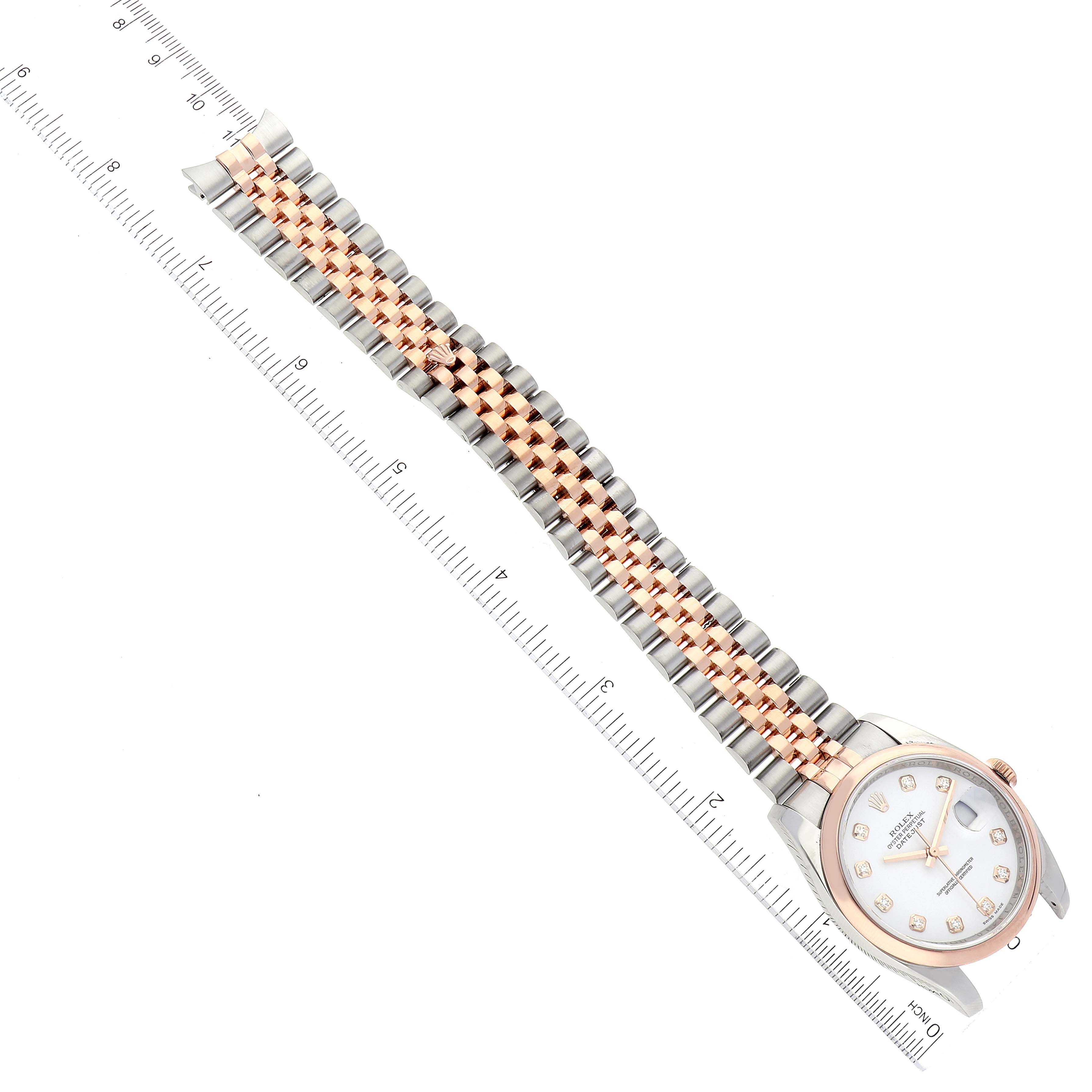 The image shows a Rolex Datejust 116201 Men's Steel and Gold (two tone) White Dial 116201 Men's Steel and Gold (two tone) White Dial watch laid flat, displaying the face, bezel, and full bracelet alongside a ruler.