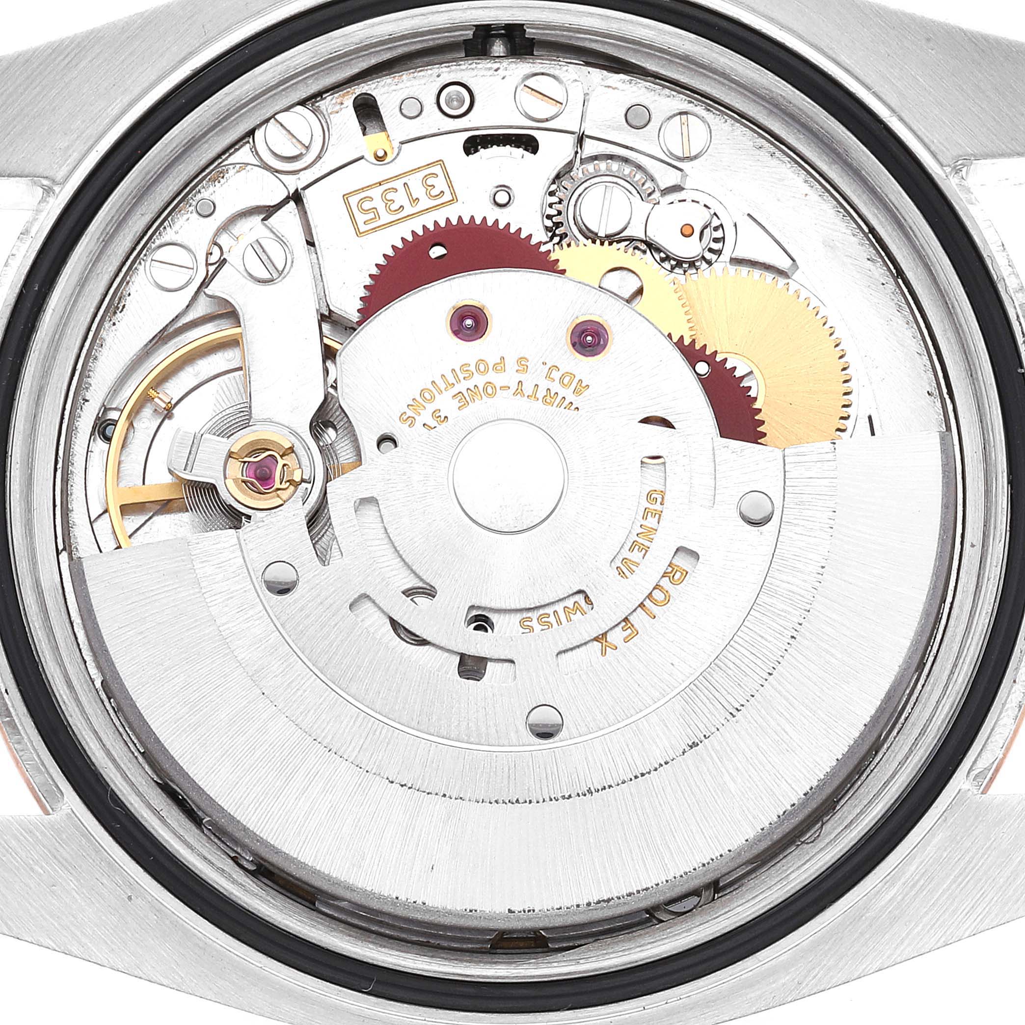 The image shows the backside of a Rolex Datejust 116201 Men's Steel and Gold (two tone) White Dial 116201 Men's Steel and Gold (two tone) White Dial watch, focusing on the exposed movement and inner mechanical parts.