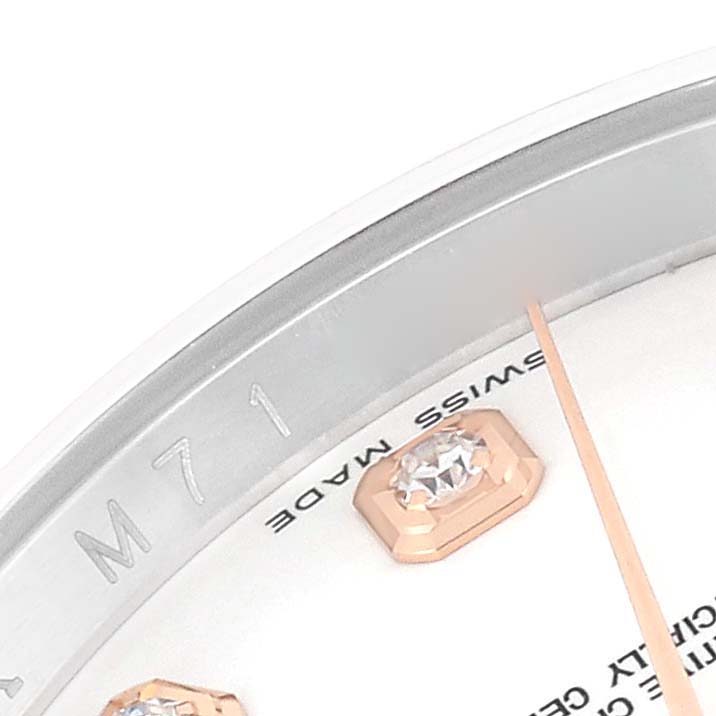 Close-up of the Rolex Datejust 116201 Men's Steel and Gold (two tone) White Dial 116201 Men's Steel and Gold (two tone) White Dial model showing part of the dial with diamond hour markers and "SWISS MADE" text.