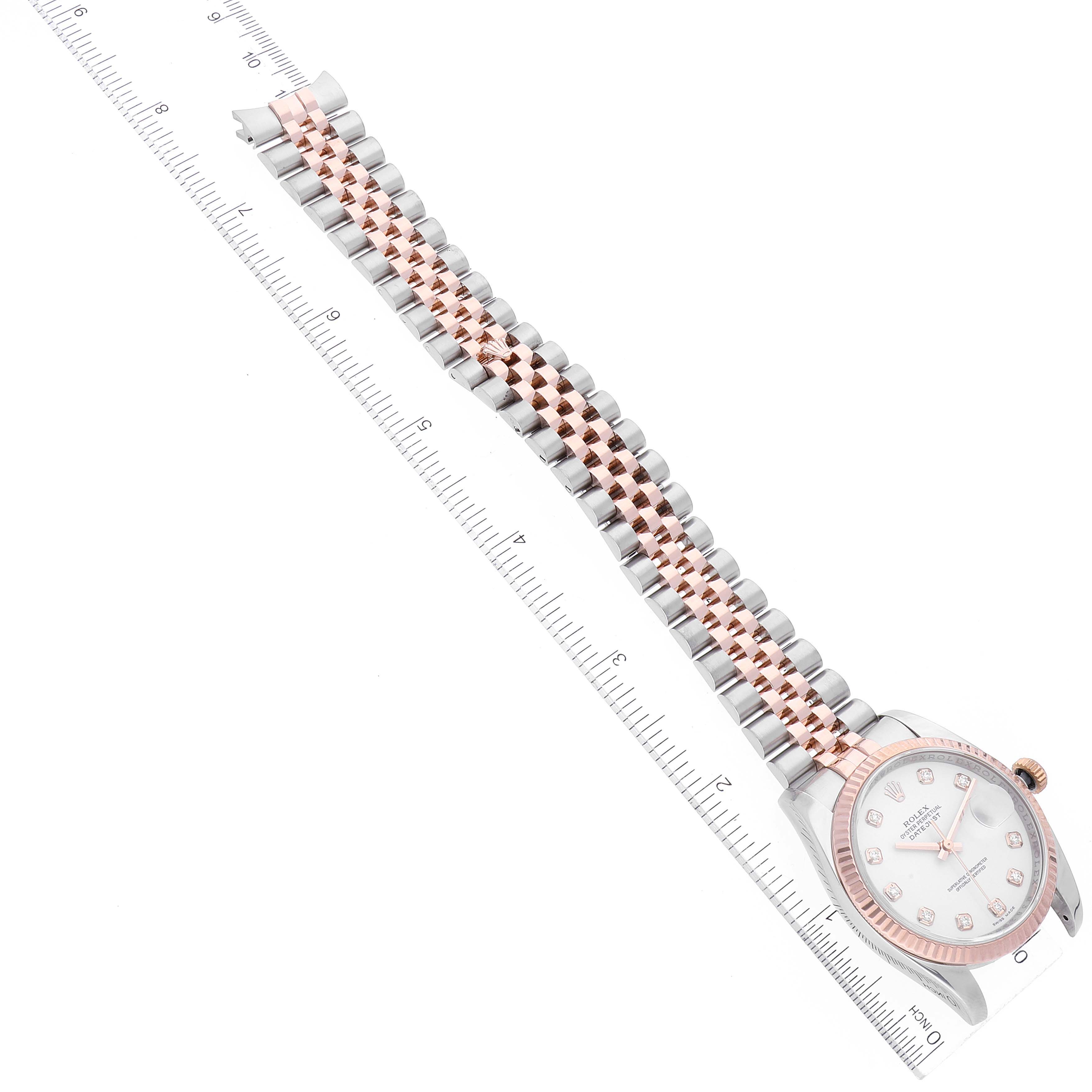 The image shows a Rolex Datejust 116231 Men's Steel and Gold (two tone) White Dial 116231 Men's Steel and Gold (two tone) White Dial watch laid flat with the face and full bracelet visible alongside a ruler.