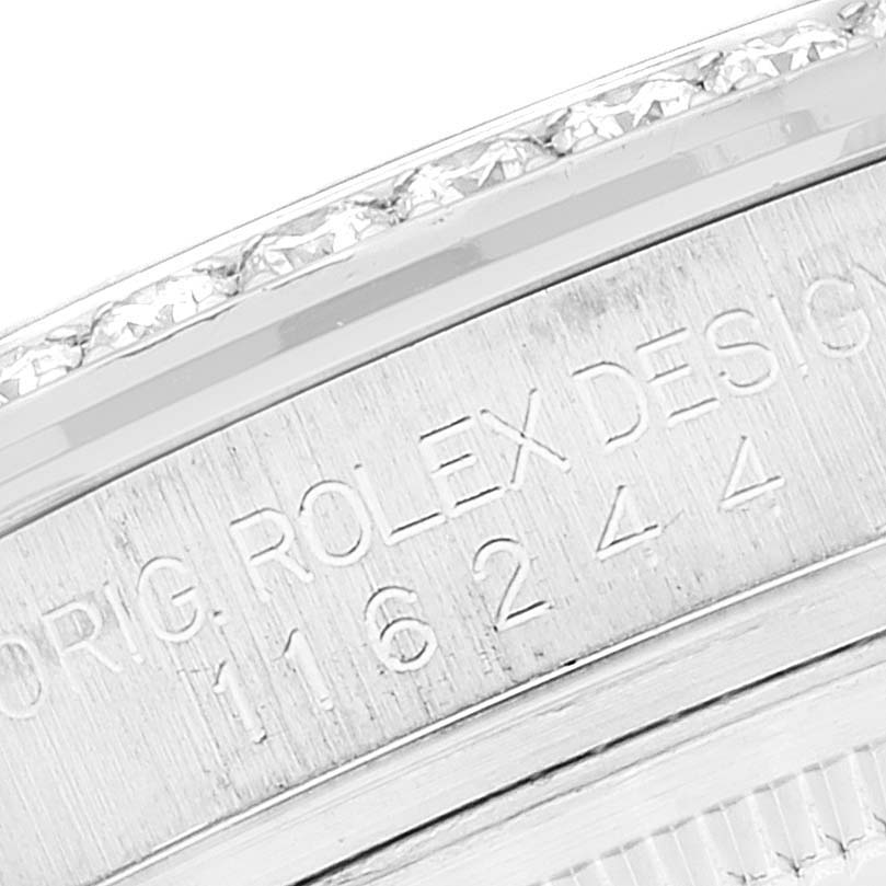 This image shows a close-up of the bezel and engraved serial number of a Rolex Datejust 116244 Men's Stainless Steel Blue Dial 116244 Men's Stainless Steel Blue Dial watch.