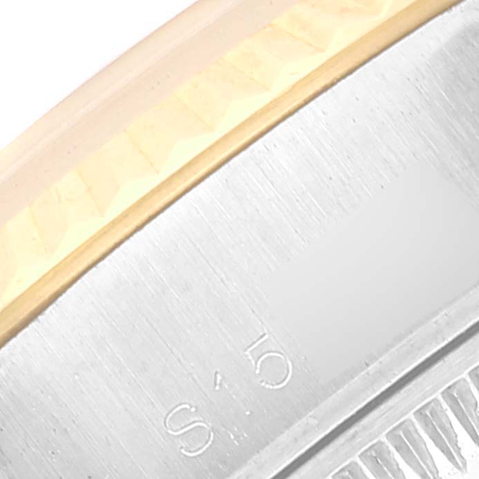 The image shows a close-up view of the side and edge of the bezel of a Rolex Datejust 69173 Women's Steel and Gold (two tone) Beige Dial 69173 Women's Steel and Gold (two tone) Beige Dial watch, highlighting its structured design.