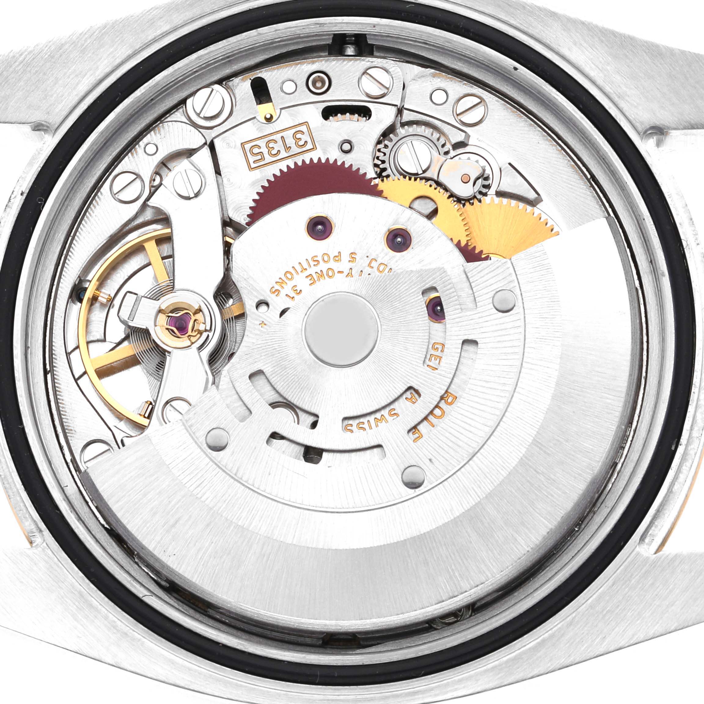 This image shows the internal mechanical movement of a Rolex Datejust 116233 Men's Steel and Gold (two tone) Champagne Dial 116233 Men's Steel and Gold (two tone) Champagne Dial watch from a close-up, back view angle.