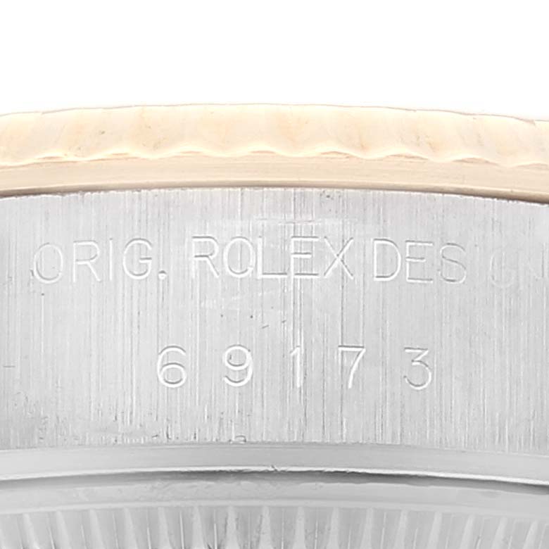 This close-up image shows the reference number and part of the bezel and case of the Rolex Datejust 69173 Women's Steel and Gold (two tone) Champagne Dial 69173 Women's Steel and Gold (two tone) Champagne Dial watch.