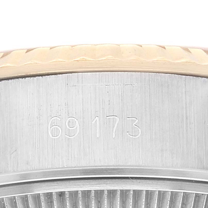 The image shows a close-up of the model number 69173 engraved on the side of the case of a Rolex Datejust 69173 Women's Steel and Gold (two tone) Champagne Dial 69173 Women's Steel and Gold (two tone) Champagne Dial watch, along with parts of the bezel and case.