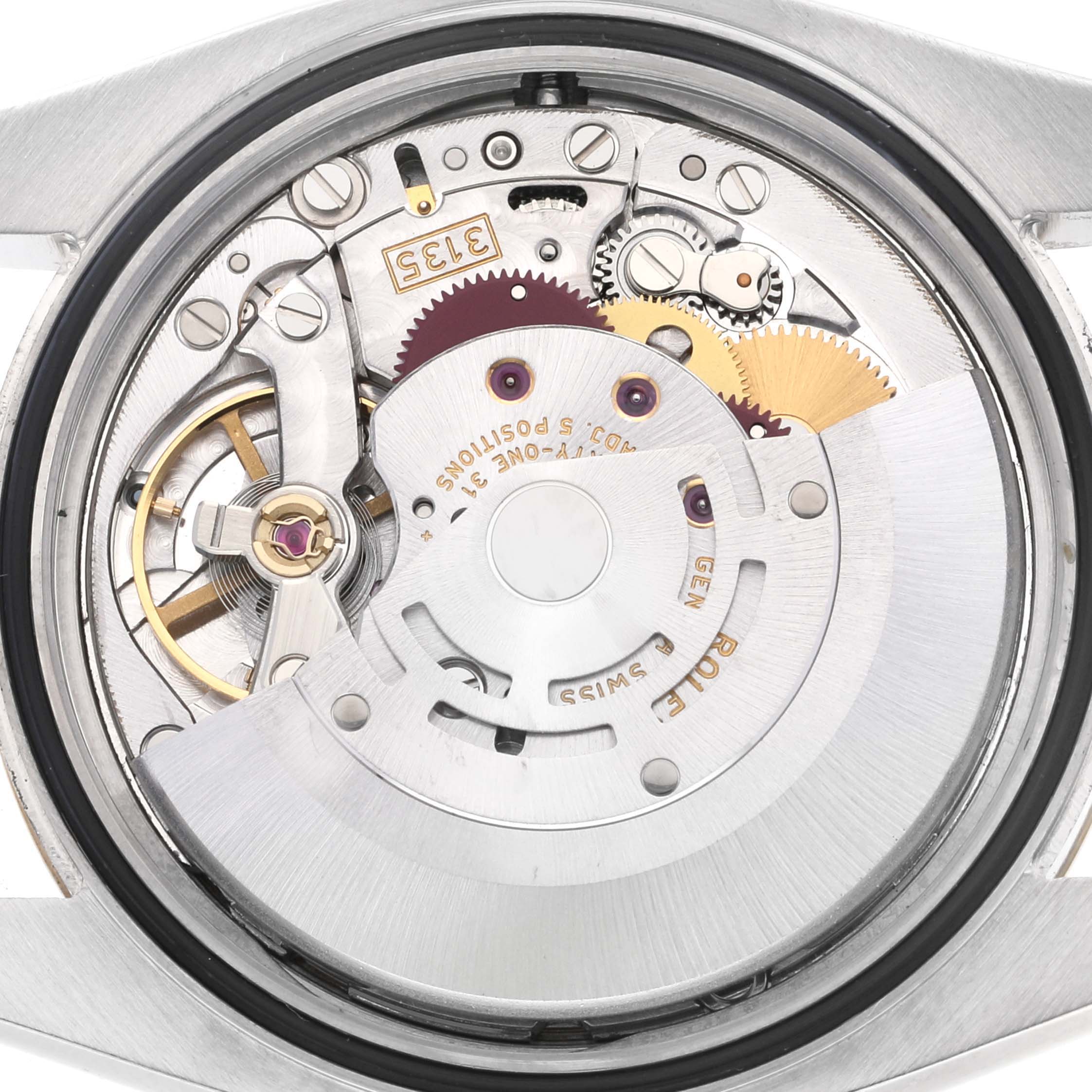 This image shows the movement mechanism of a Rolex Datejust 116233 Men's Steel and Gold (two tone) Champagne Dial 116233 Men's Steel and Gold (two tone) Champagne Dial watch from a rear angle with the case back removed.