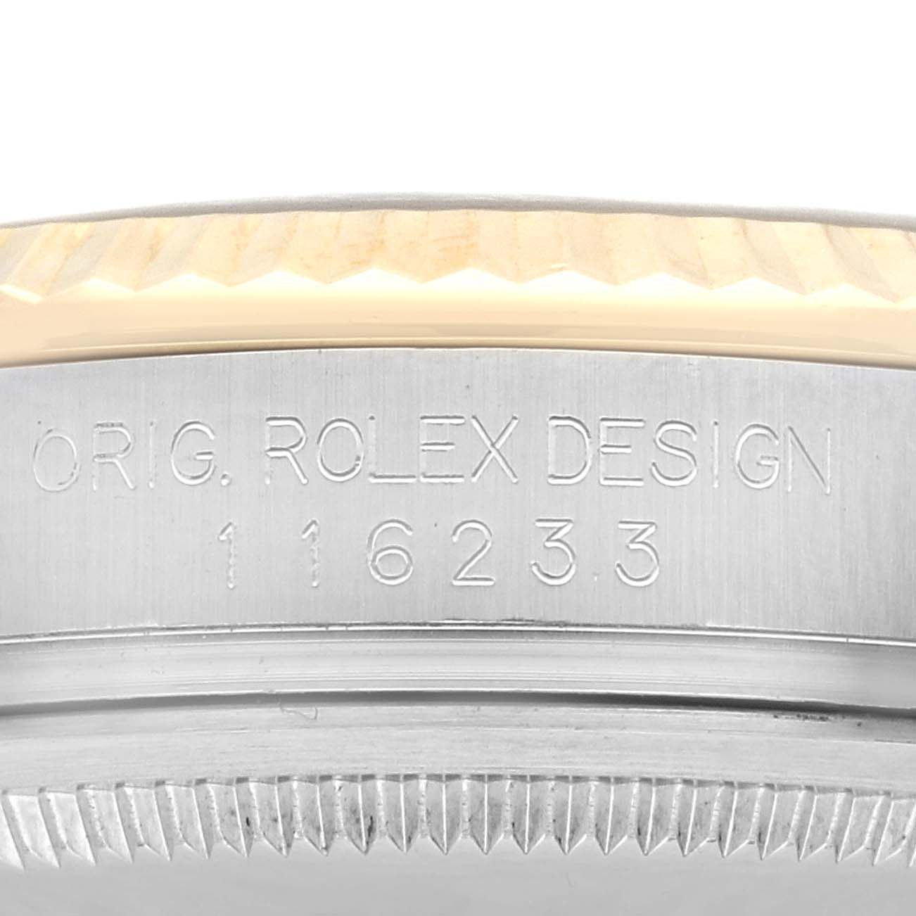 This image shows a close-up of the side engraving on a Rolex Datejust 116233 Men's Steel and Gold (two tone) Champagne Dial 116233 Men's Steel and Gold (two tone) Champagne Dial watch, highlighting the model number and "ORIG. ROLEX DESIGN."
