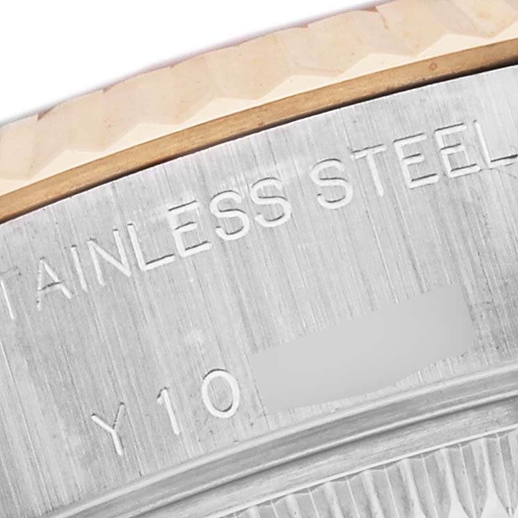 A close-up of a Rolex Datejust 79173 Women's Steel and Gold (two tone) Silver Dial 79173 Women's Steel and Gold (two tone) Silver Dial watch showing the stainless steel case and part of the fluted bezel.