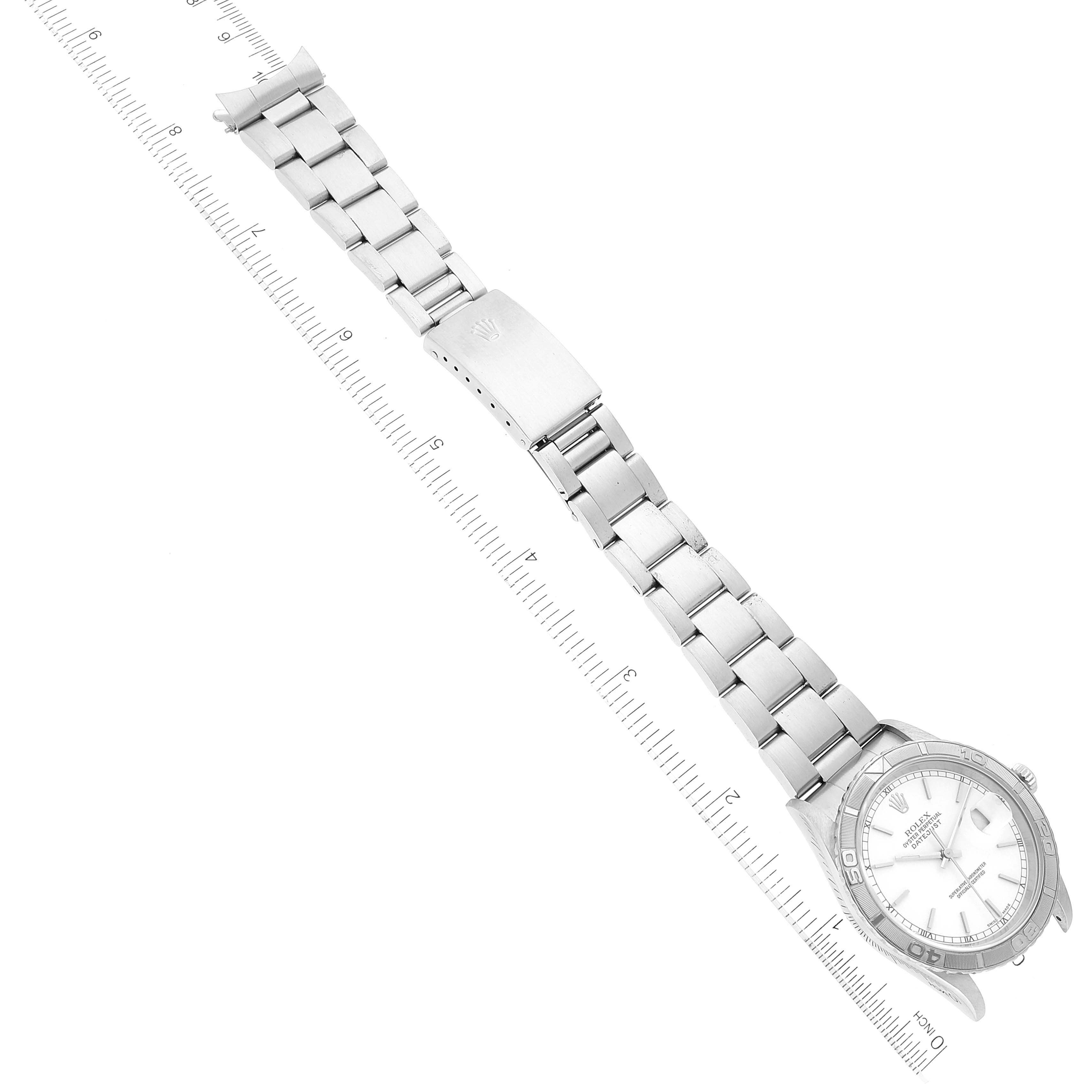 The image shows an aerial view of a Rolex Turn-o-Graph 16264 Men's Stainless Steel White Dial 16264 Men's Stainless Steel White Dial watch, displaying its face and metal bracelet with the clasp open.