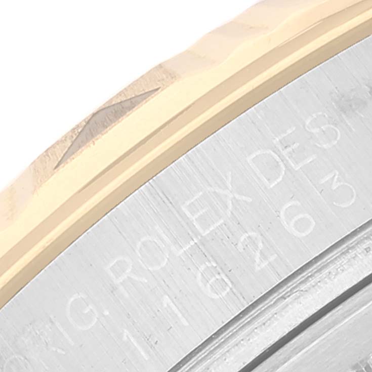 The image shows a close-up of the bezel and engraved case side of a Rolex Turn-o-Graph 116263 Men's Steel and Gold (two tone) Grey Dial 116263 Men's Steel and Gold (two tone) Grey Dial watch.