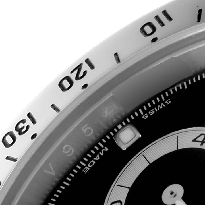 The image shows a close-up of the bezel and part of the dial, including the "SWISS MADE" text, of a Rolex Daytona 116520 Men's Stainless Steel Black Dial 116520 Men's Stainless Steel Black Dial watch.
