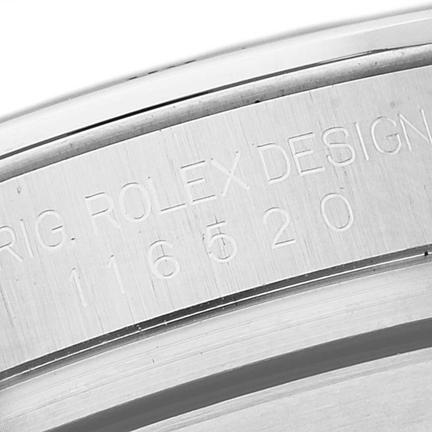 This image shows a close-up view of the engraved serial number and design details on the side of a Rolex Daytona 116520 Men's Stainless Steel Black Dial 116520 Men's Stainless Steel Black Dial model.
