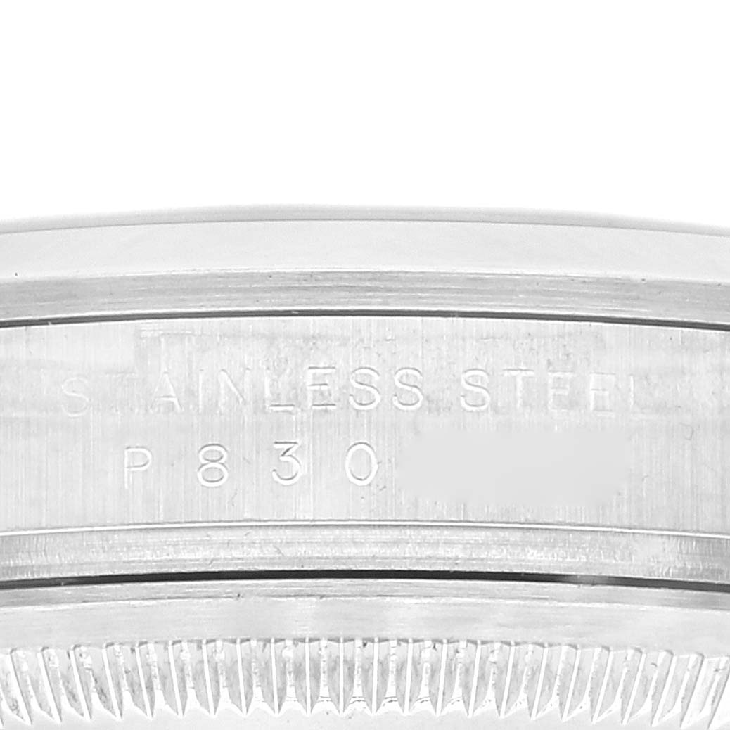 This is a close-up angle showing the case back edge engraving of a Rolex Explorer 114270 Men's Stainless Steel Black Dial 114270 Men's Stainless Steel Black Dial watch, indicating it's made of stainless steel.