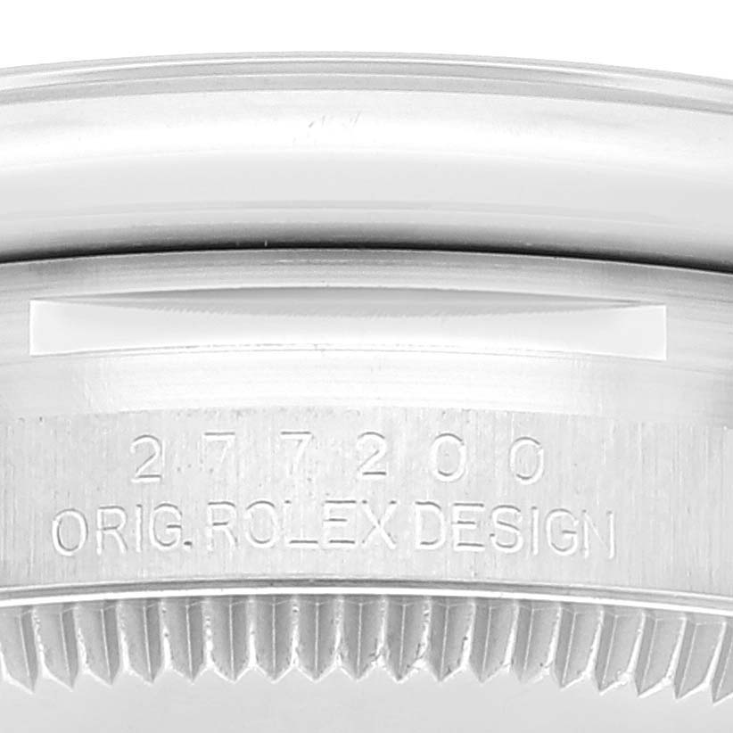 This image shows a close-up of the engraved case back and serial number of a Mid-Size Rolex watch model 277200.