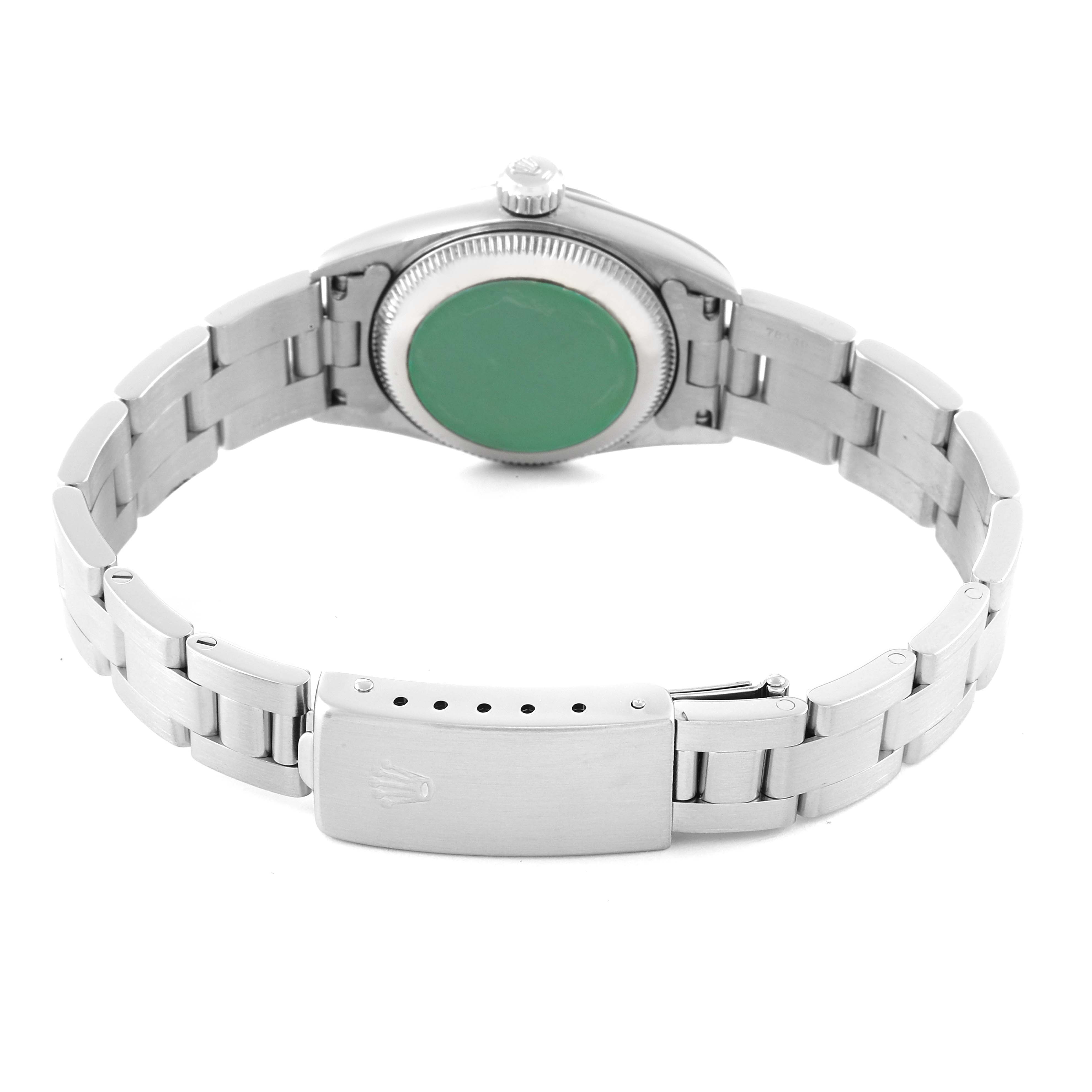 This image shows the back view of a Rolex Oyster Perpetual 67194 Women's Stainless Steel Silver Dial 67194 Women's Stainless Steel Silver Dial watch, displaying the case back, crown, and bracelet with the clasp.