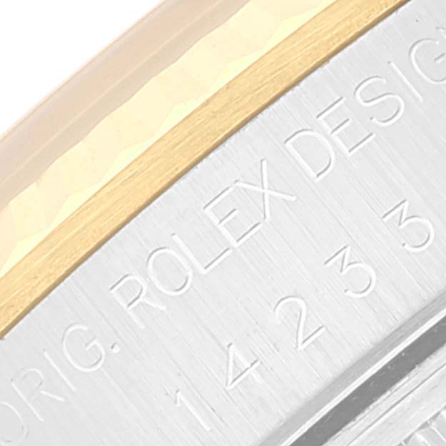 The image shows a close-up of the side bezel and engraving of an Oyster Perpetual Rolex watch.