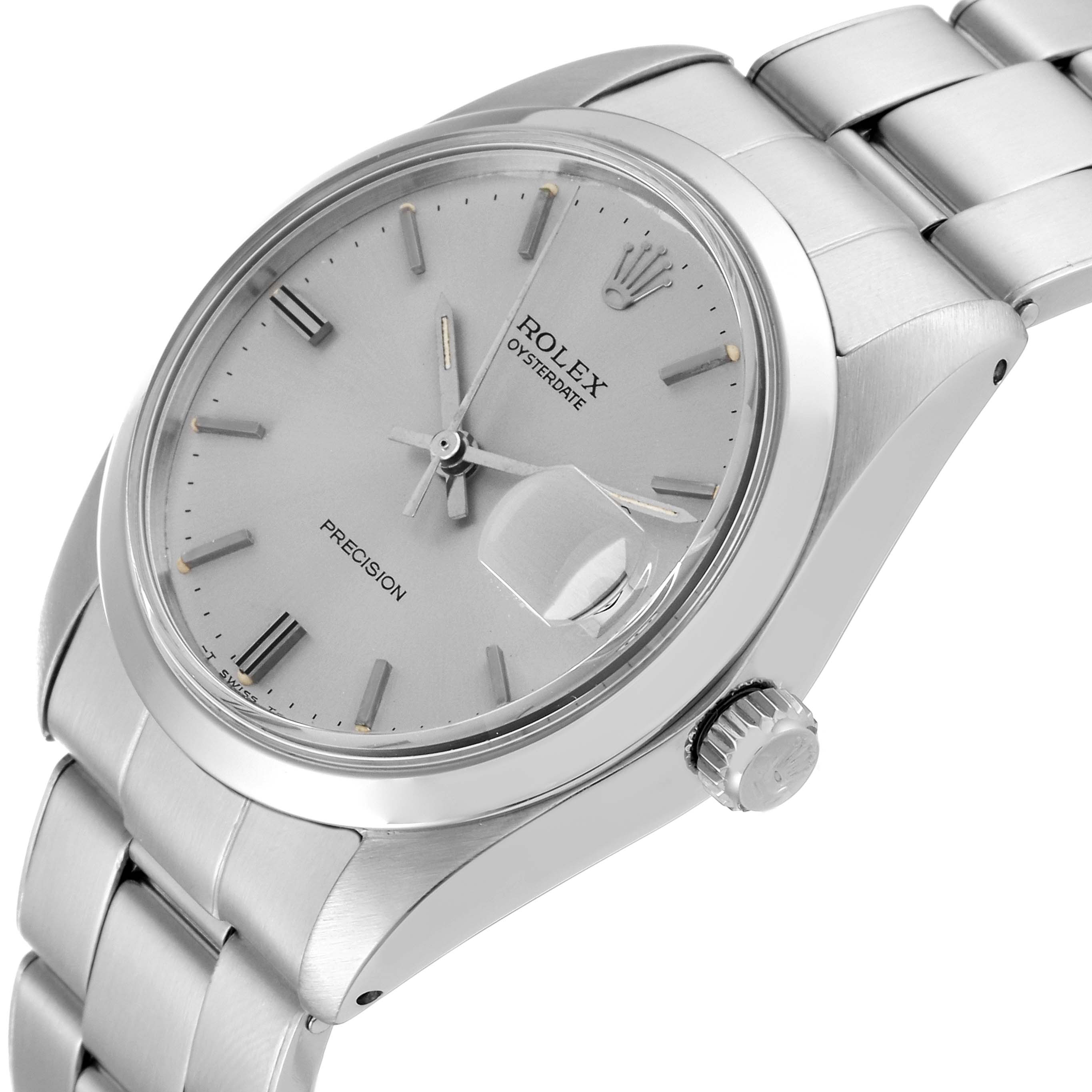 This image shows a side-angle view of the face, crown, and part of the band of the Rolex Vintage Collection 6694 Men's Stainless Steel Silver Dial 6694 Men's Stainless Steel Silver Dial Oysterdate Precision watch.