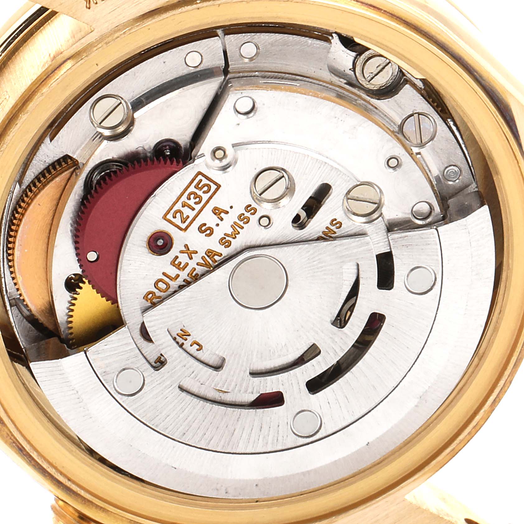 The image shows a close-up of the internal movement of a Rolex President 69158 Women
s Yellow Gold Champagne Dial 69158 Women
s Yellow Gold Champagne Dial watch, highlighting its intricate mechanical parts.
