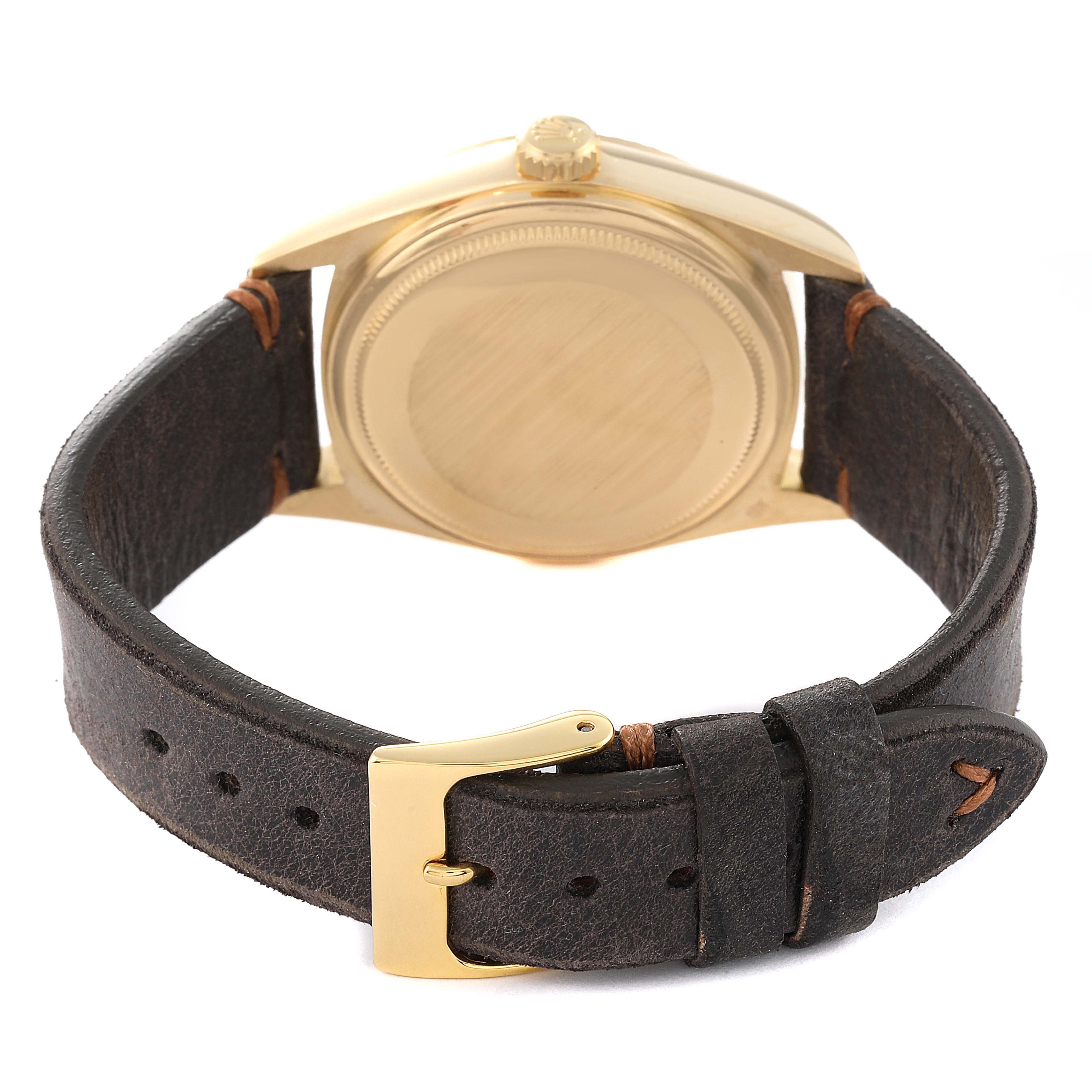This image shows the rear view of a Rolex President 18038 Men's Yellow Gold Champagne Dial 18038 Men's Yellow Gold Champagne Dial watch, highlighting the case back, crown, and leather strap with a buckle.