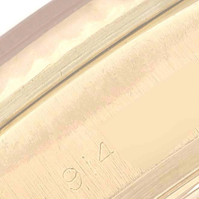 This image shows a close-up of the case back edge and serial number of a Rolex President 18038 Men's Yellow Gold Champagne Dial 18038 Men's Yellow Gold Champagne Dial model watch.