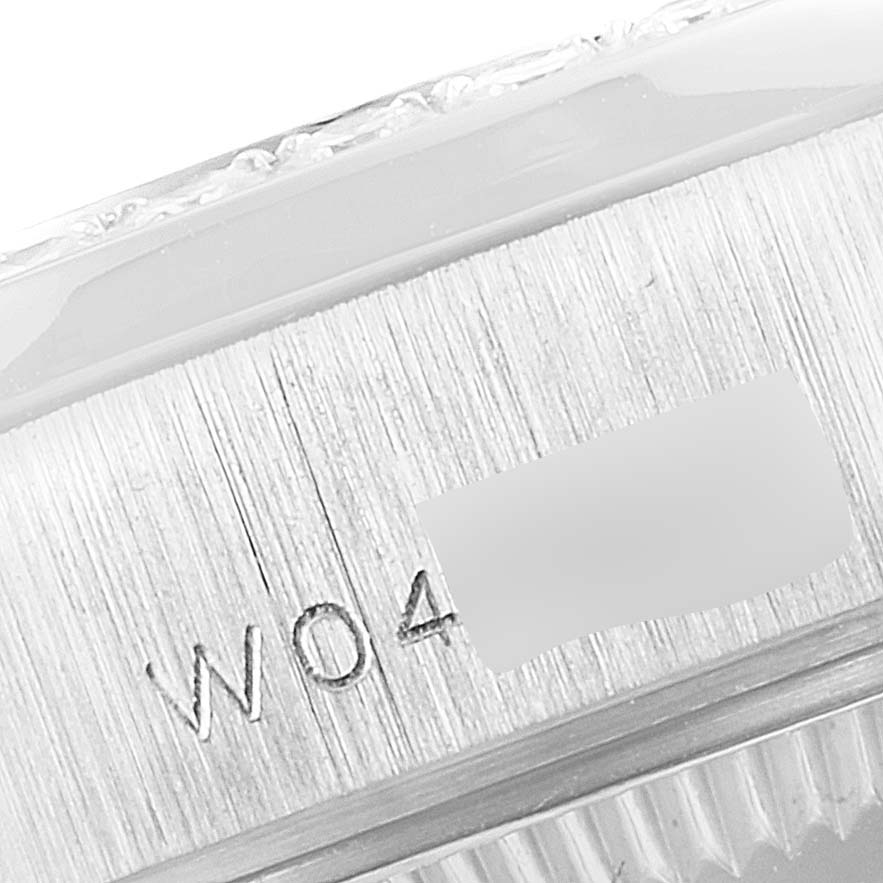 The image shows a close-up of the serial number area on the case side of a Rolex President 69136 Women's Platinum Mother of Pearl Dial 69136 Women's Platinum Mother of Pearl Dial model watch.
