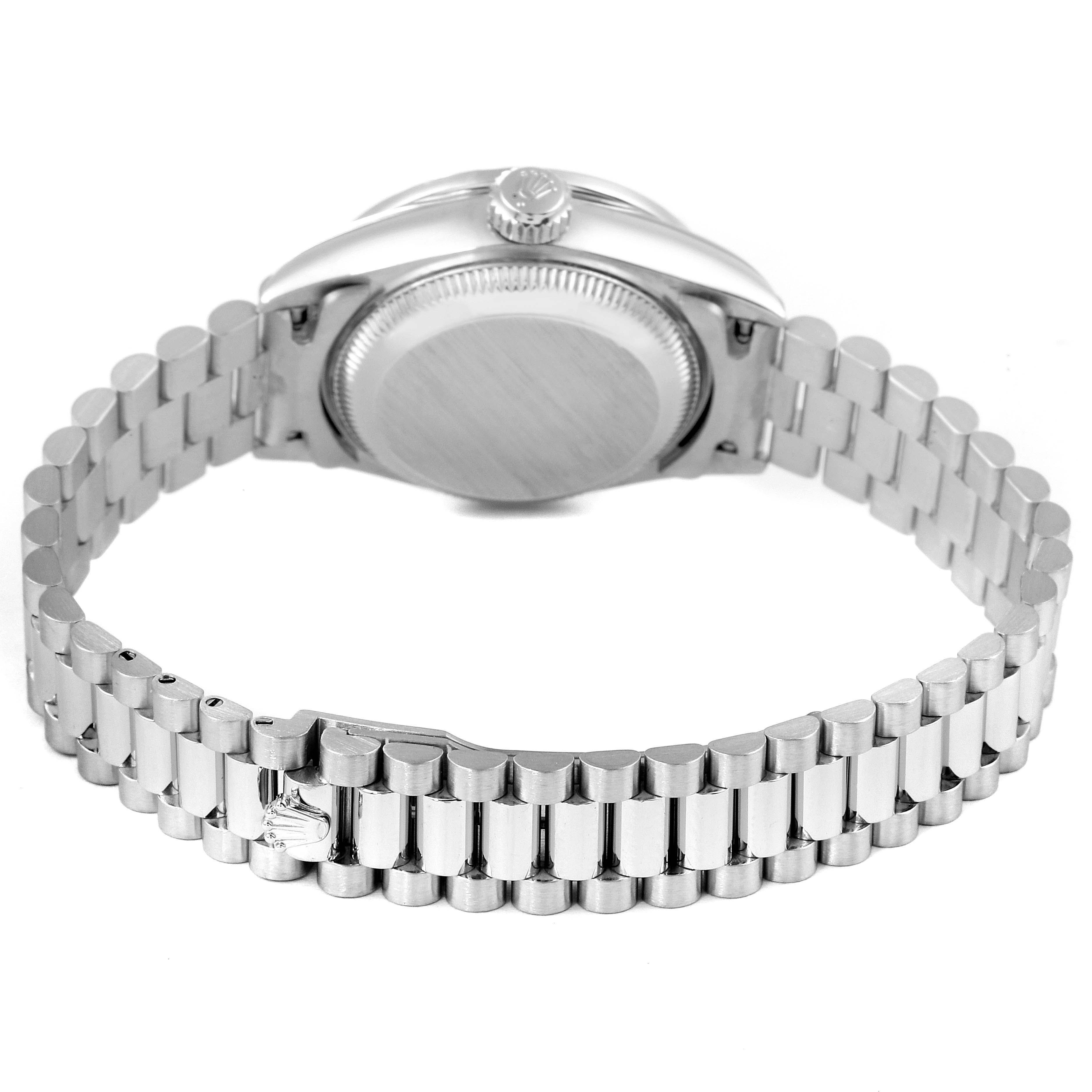 The image shows the back view of a Rolex President 69136 Women's Platinum Mother of Pearl Dial 69136 Women's Platinum Mother of Pearl Dial model watch, highlighting its case back and bracelet.