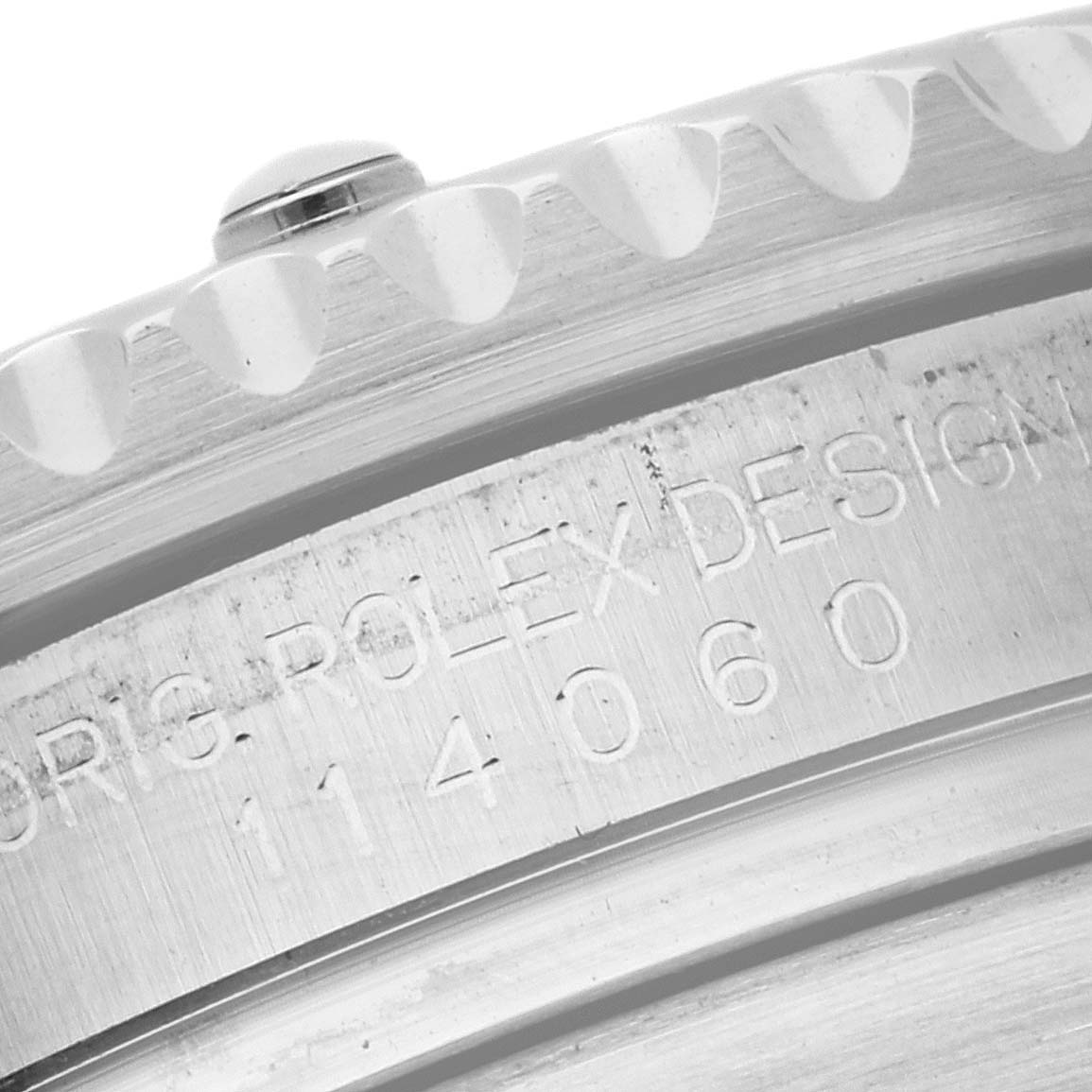 This close-up image shows the engraved case back and bezel of the Rolex Submariner 114060 Men
s Stainless Steel Black Dial 114060 Men
s Stainless Steel Black Dial watch.