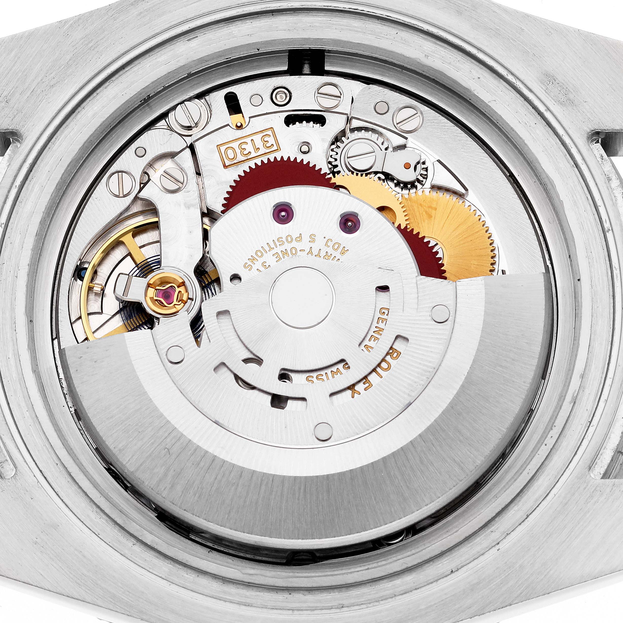 The image shows a close-up view of the movement mechanism inside a Rolex Submariner 114060 Men
s Stainless Steel Black Dial 114060 Men
s Stainless Steel Black Dial watch.