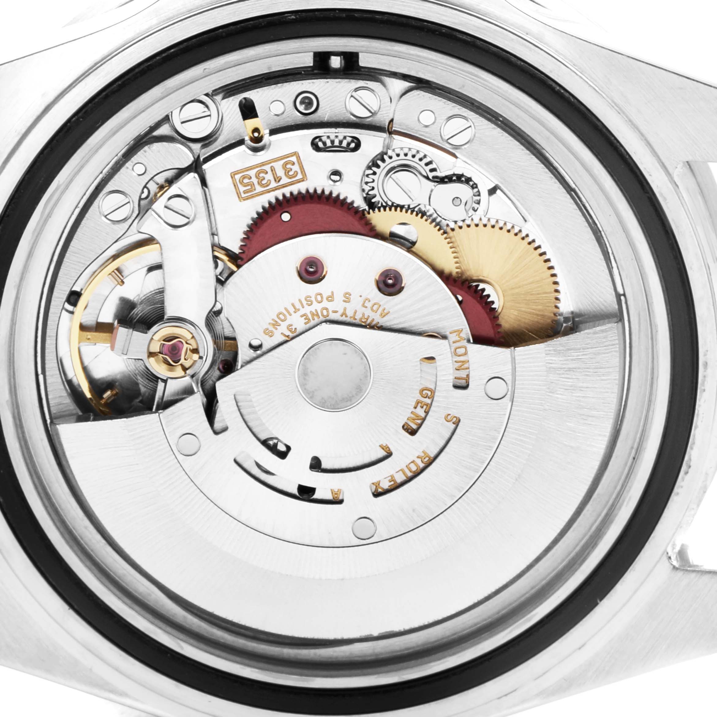 The image shows the internal mechanism of a Rolex Submariner 16610 Men's Stainless Steel Black Dial 16610 Men's Stainless Steel Black Dial model, viewed from the back, highlighting gears and components.