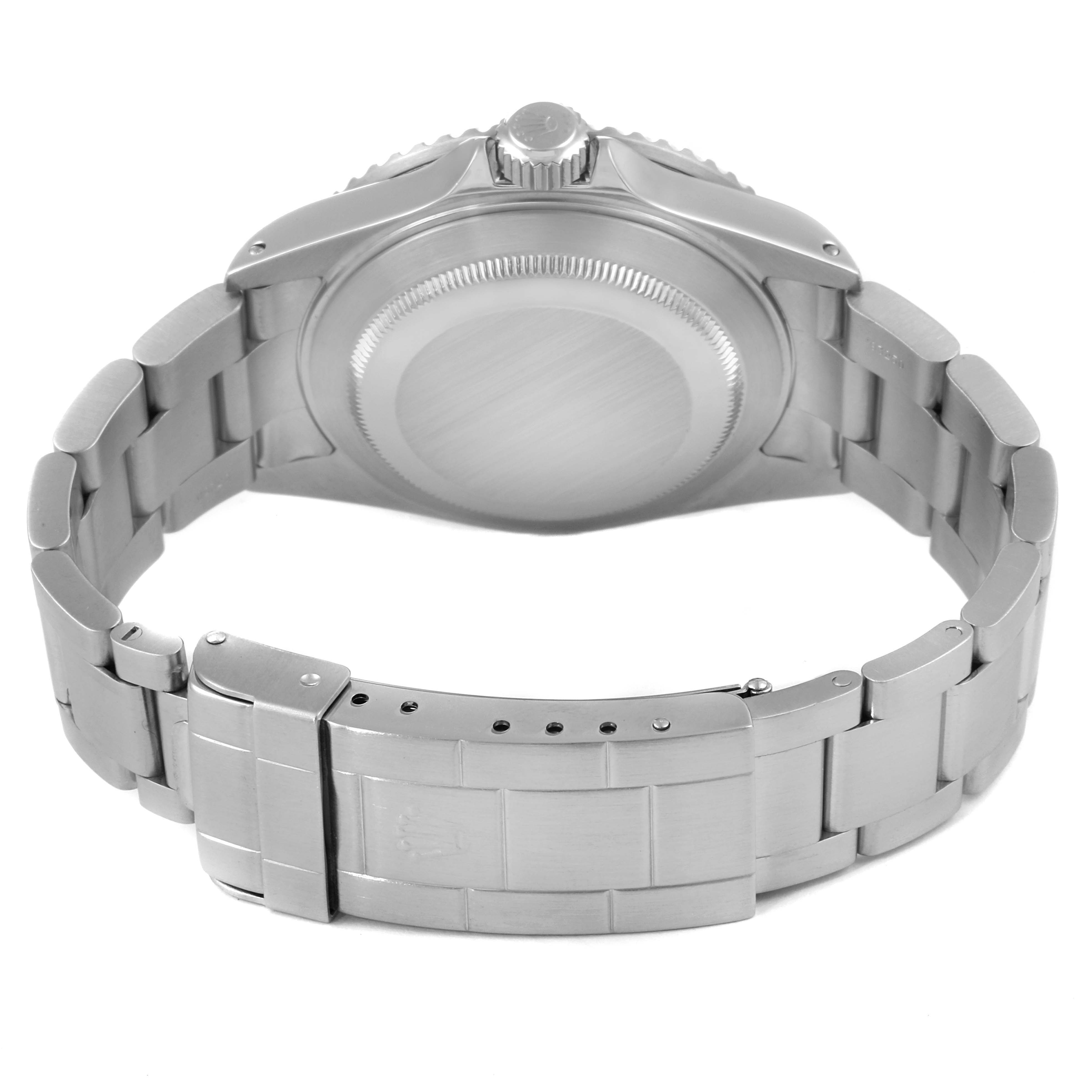 The image shows the back side of a Rolex Submariner 16610 Men's Stainless Steel Black Dial 16610 Men's Stainless Steel Black Dial watch, displaying the case back, bracelet, and clasp.