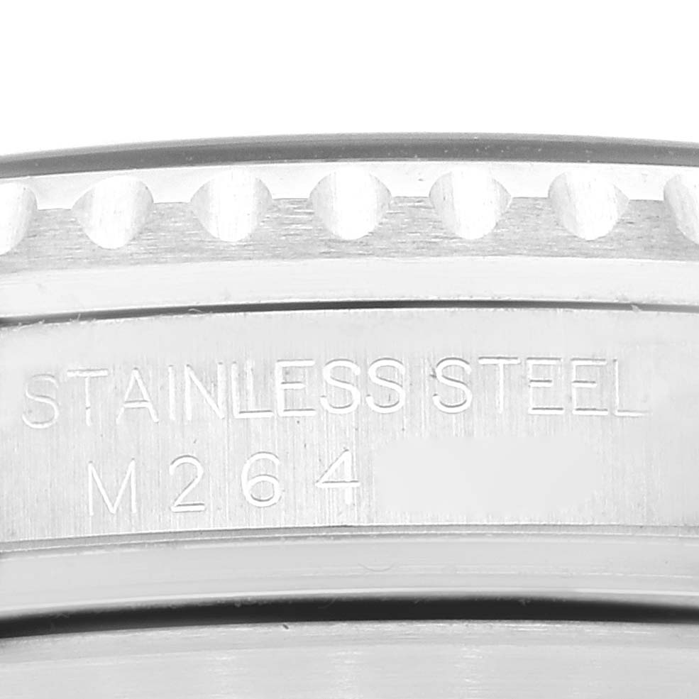 The image shows a close-up of the bezel and side engraving of a stainless steel Rolex Submariner 16610 Men's Stainless Steel Black Dial 16610 Men's Stainless Steel Black Dial, displaying the material and part number.