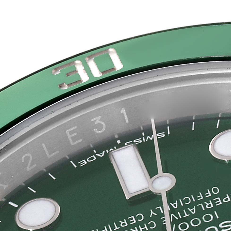 This image shows a close-up of the green bezel and part of the dial on a Rolex Submariner 116610LV Men
s Stainless Steel Green Dial 116610LV Men
s Stainless Steel Green Dial watch.