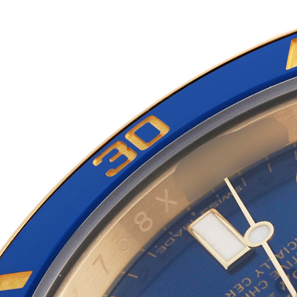 This close-up image shows the bezel, dial, and partially the minute hand of a Rolex Submariner 116618LB Men's Yellow Gold Blue Dial 116618LB Men's Yellow Gold Blue Dial watch.