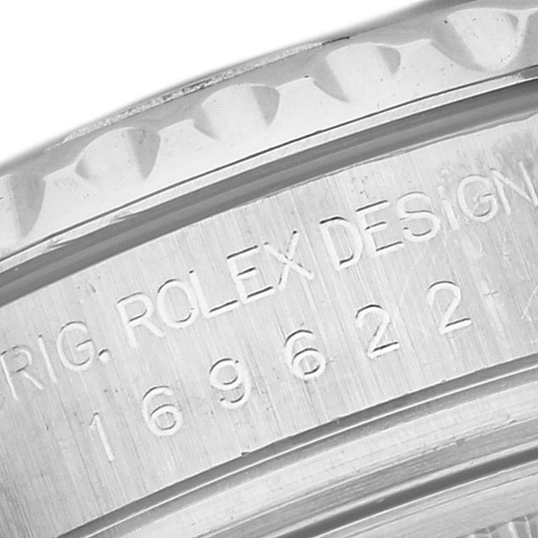 This close-up image shows the engraved side detail of the bezel on a Rolex Yacht-Master 169622 Women
s Stainless Steel Silver Dial 169622 Women
s Stainless Steel Silver Dial watch.