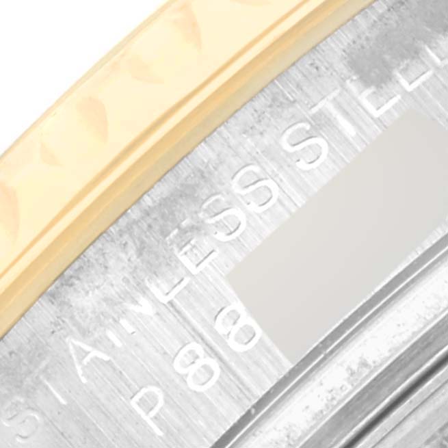 A close-up of the Rolex Yacht-Master 169623 Women's Steel and Gold (two tone) White Dial 169623 Women's Steel and Gold (two tone) White Dial watch showing part of the bezel and engraved text on the metal surface.