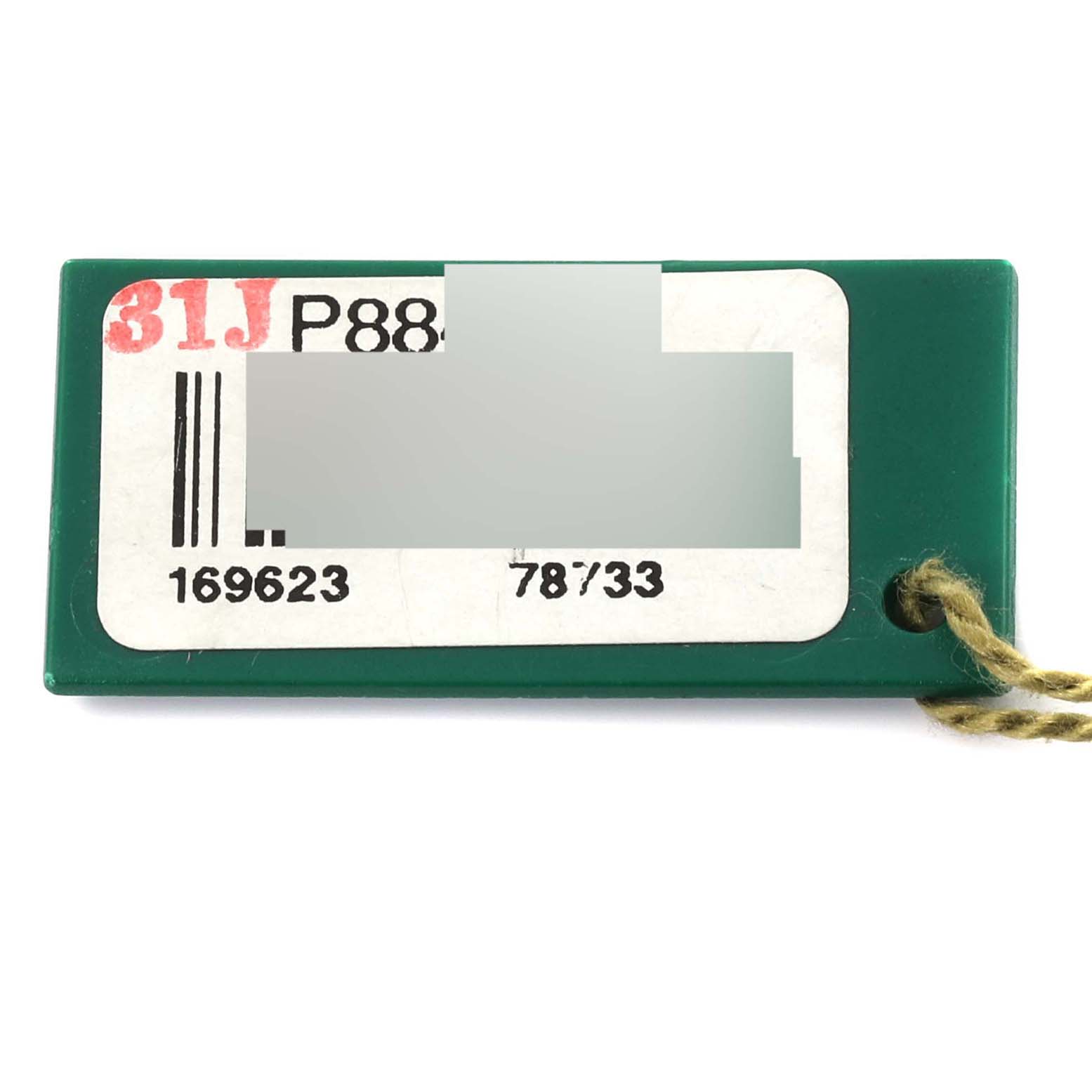 This image shows a green Rolex Yacht-Master 169623 Women's Steel and Gold (two tone) White Dial 169623 Women's Steel and Gold (two tone) White Dial model tag with reference numbers and a string attached.